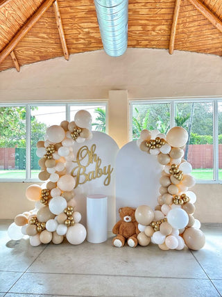 Neutral backdrop and balloons arch colors Set up