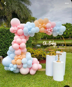 Gender reveal decor with a round gold hoop